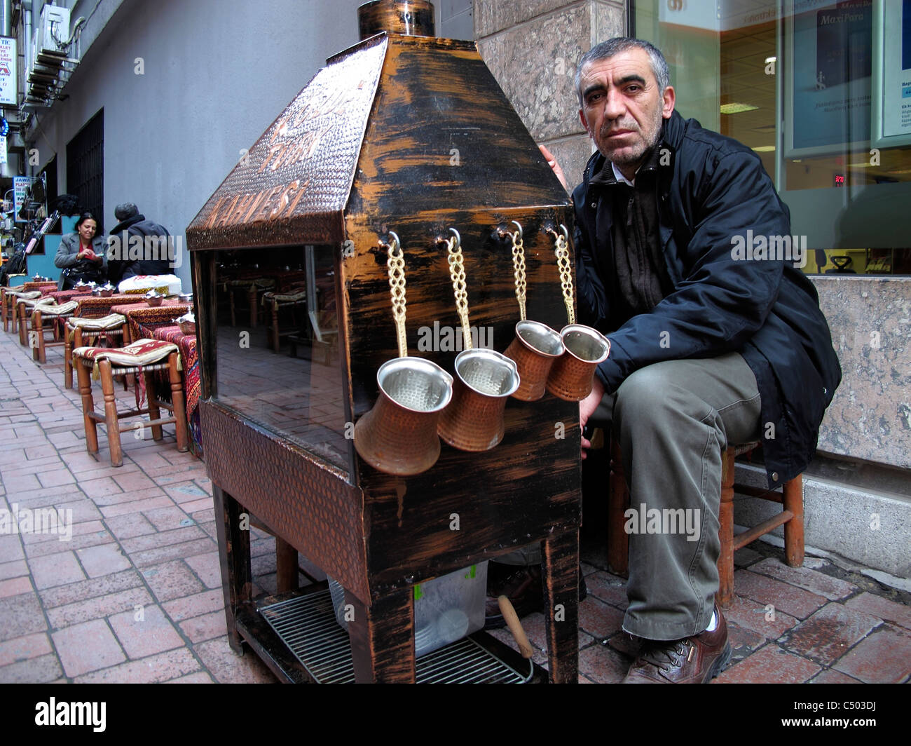 Turkey Istanbul Sultanahmet old town Turkish coffee vendor at side