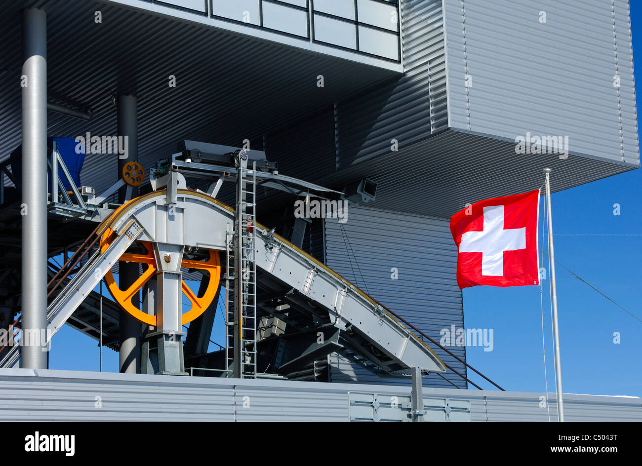 Swiss engineering, the Swiss flag in front of machinery, Switzerland Stock Photo