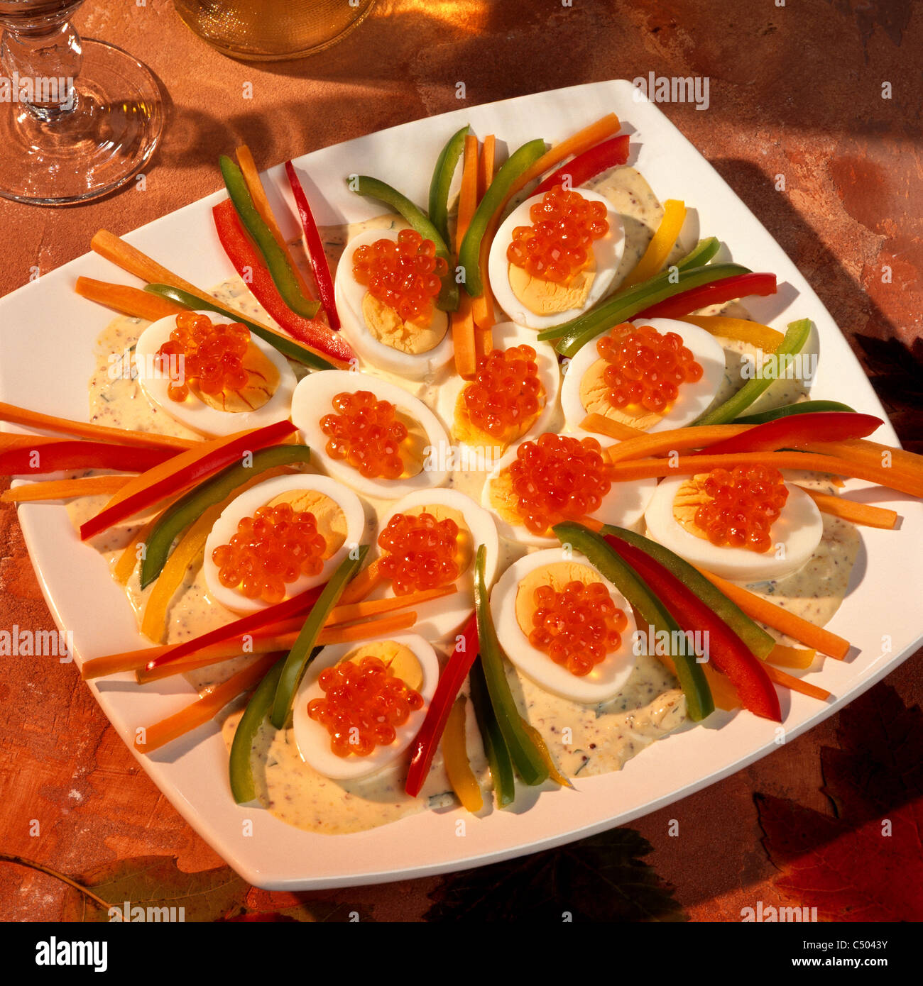Eggs with caviar, with mustard onion sauce Stock Photo Alamy