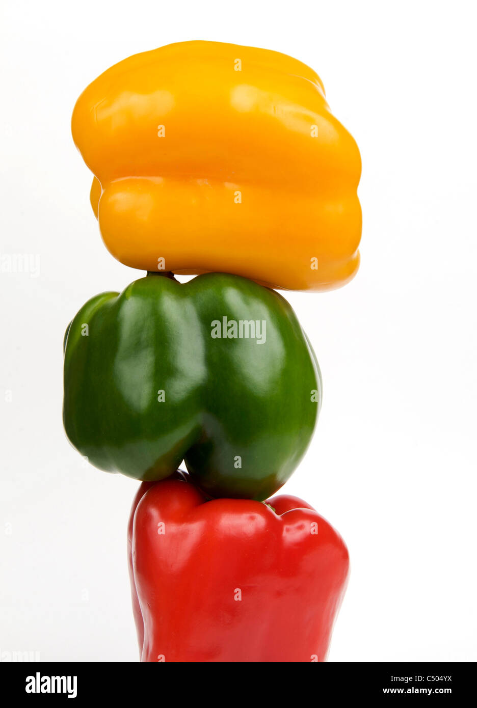 Three stacked peppers Stock Photo