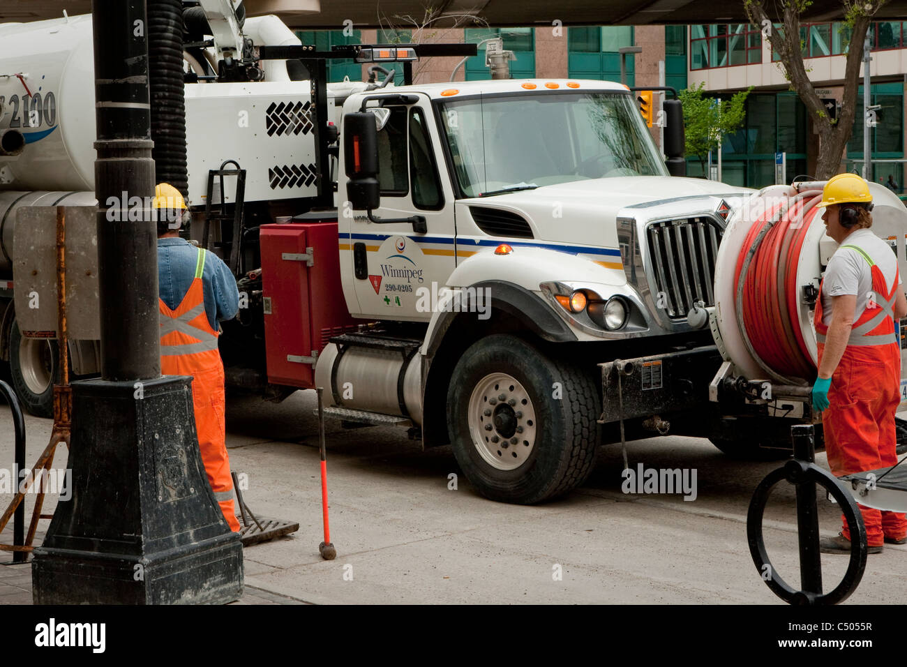 Winnipeg Public works employees are setting up equipment on Portage