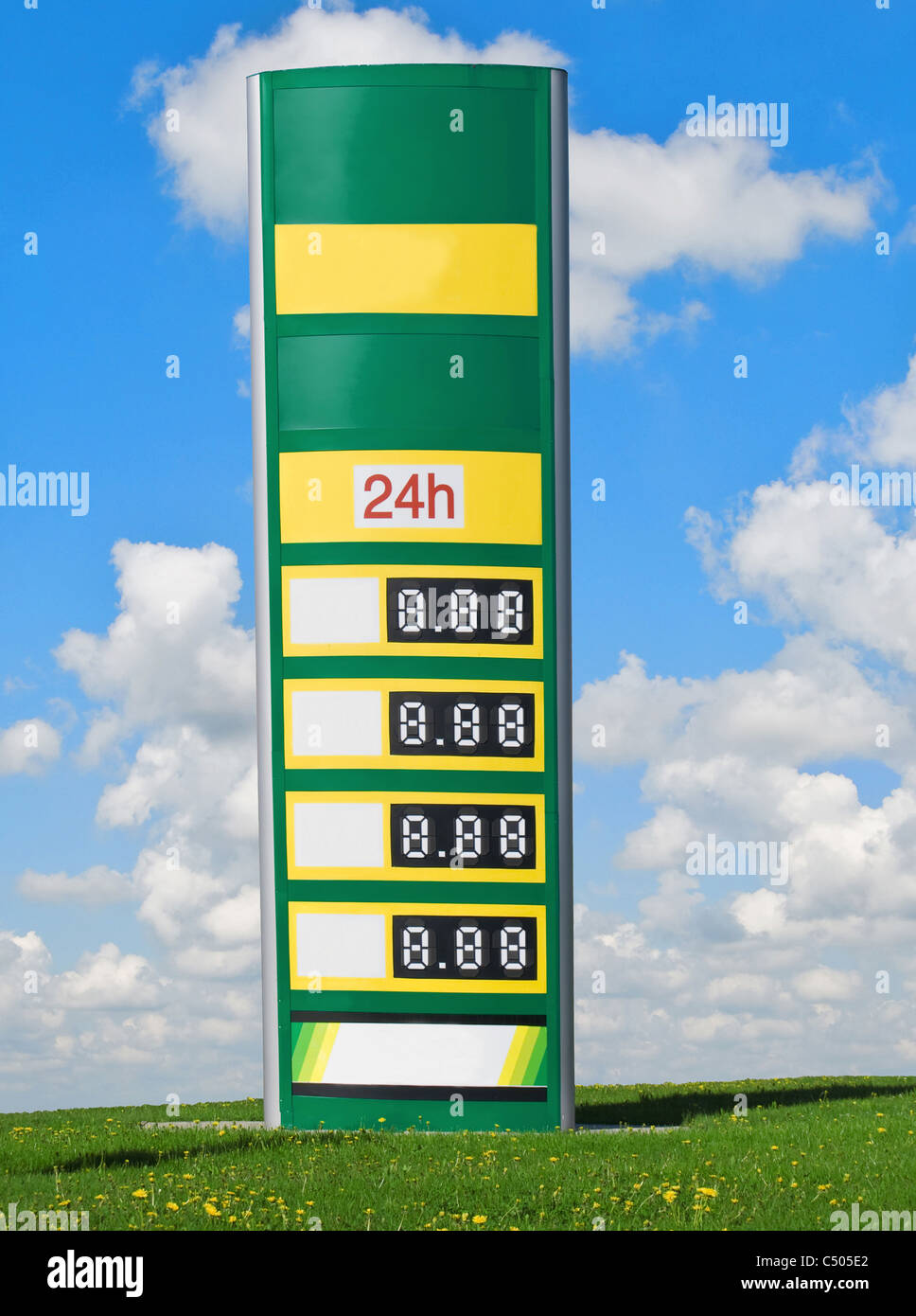 gasoline prices on a sign with sky and clouds in background Stock Photo