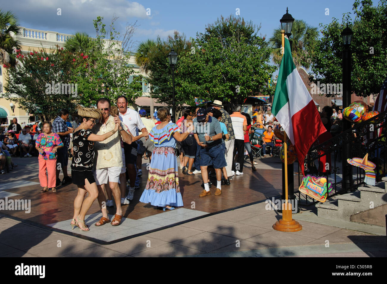 Residents of The Villages in Florida USA dancing in the town square during the Cinco De Mayo festival Stock Photo