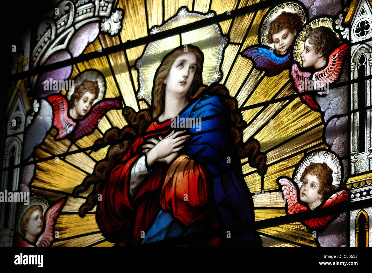 A stained glass window depicting an angel. Stock Photo