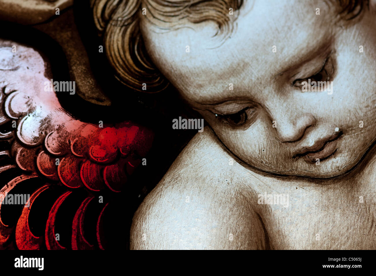 A stained glass window depicting an angel. Stock Photo