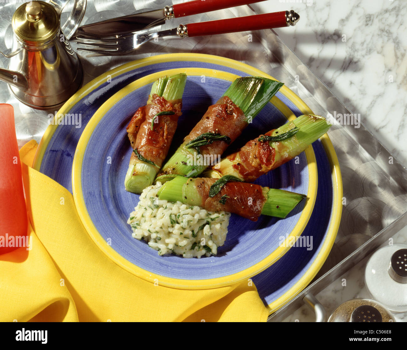 Leek wrapped up with gammon Stock Photo - Alamy