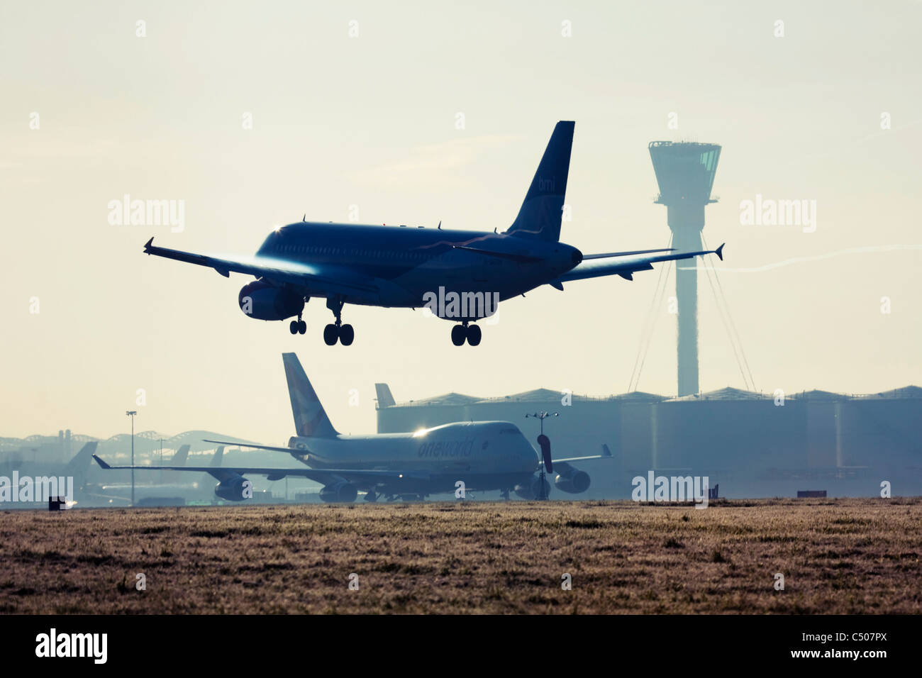 Airplane landing at London Heathrow Airport. Stock Photo