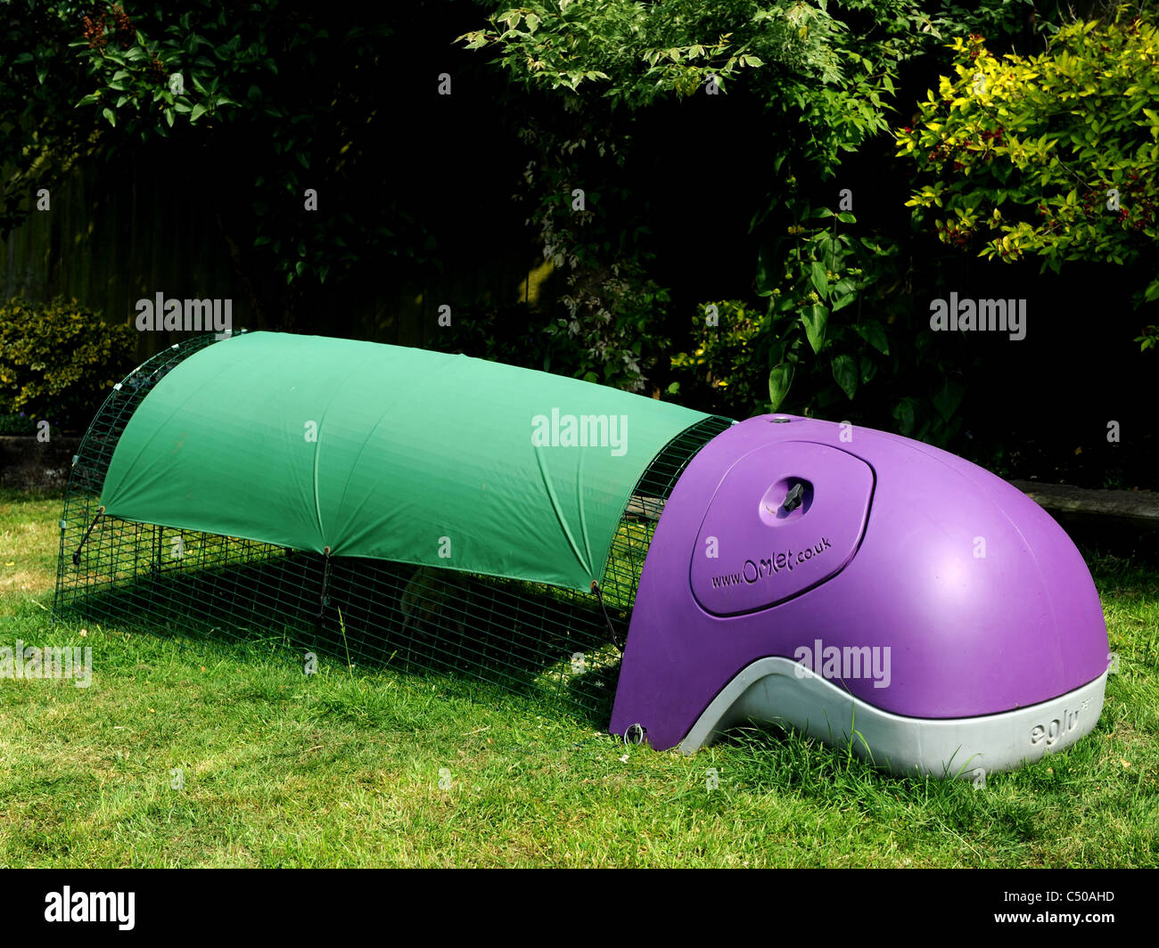 A modern rabbit run with sleeping area made by Omlet. Stock Photo