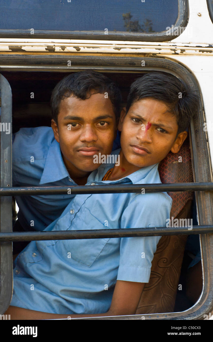 Indian teenagers in a schoolbus in Karnataka province. Stock Photo