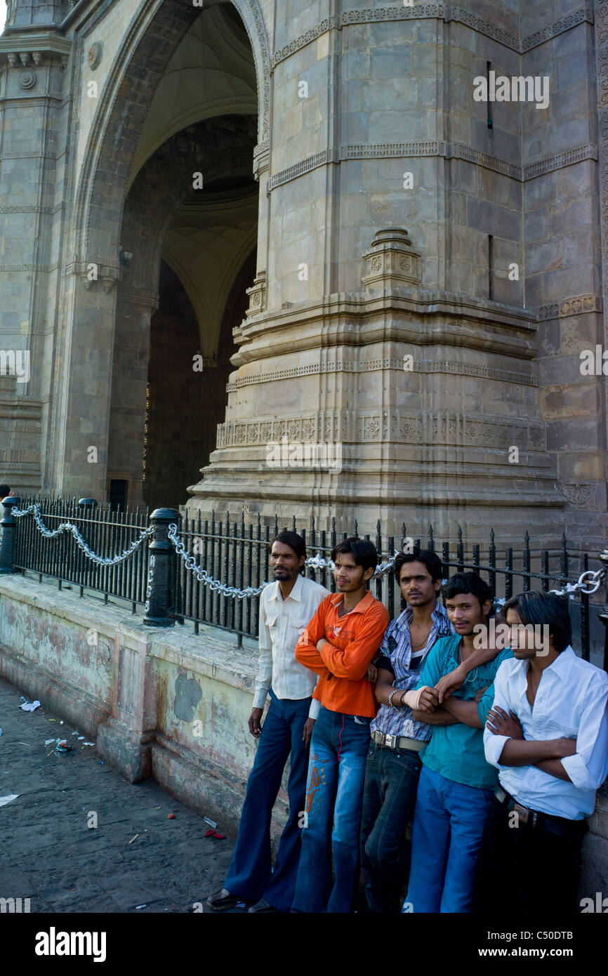 A group of young men hanging out at Gateway of India, Mumbai. Stock Photo