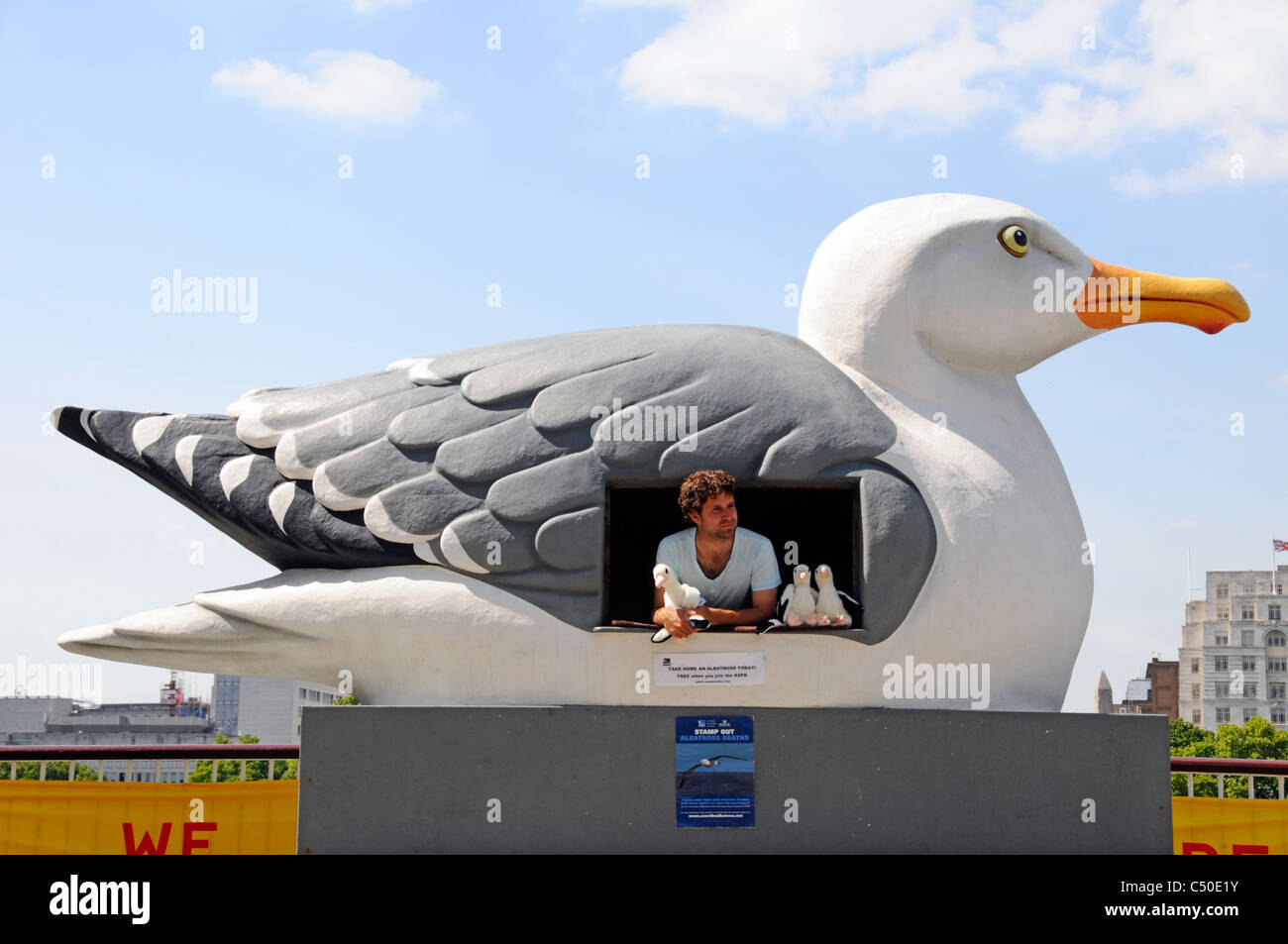 Large seabird shaped cabin used by man selling membership of RSPB charit & giving away toy Albatross to new members Southbank centre Lambeth London UK Stock Photo