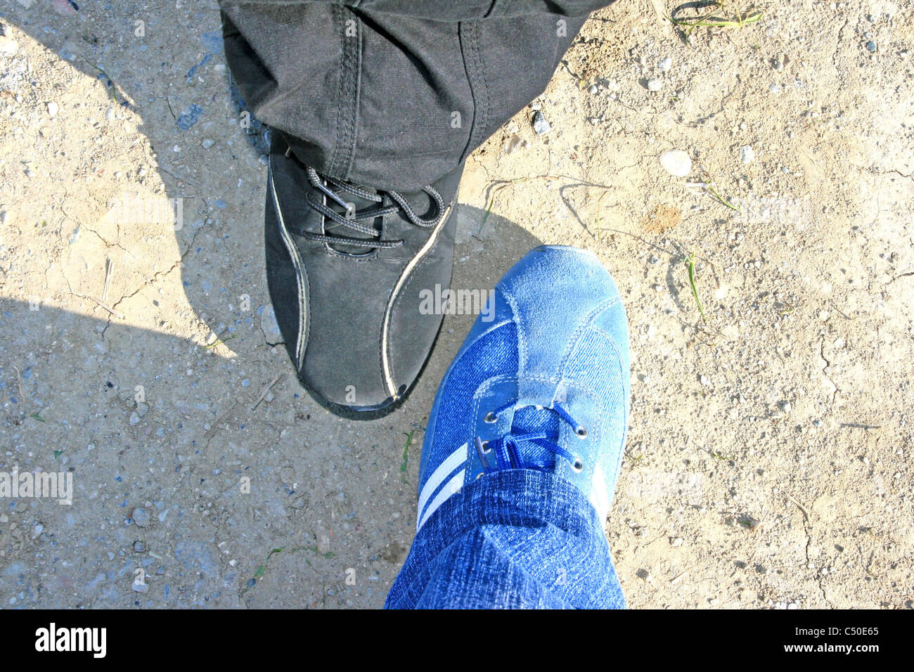Blue and black shoes and trousers Stock Photo - Alamy