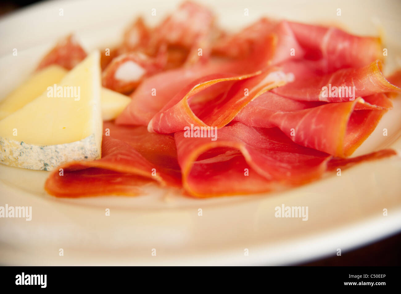Close up of cheese and  prosciutto Stock Photo