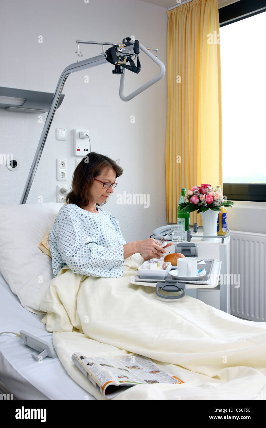 Hospital patient eating dinner hi-res stock photography and images - Alamy