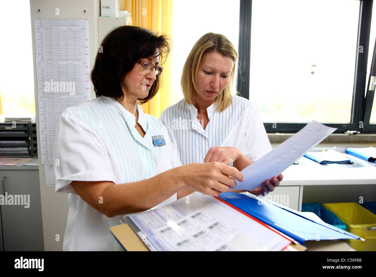Hospital. Nurses working in a hospital ward, nurses office, doing