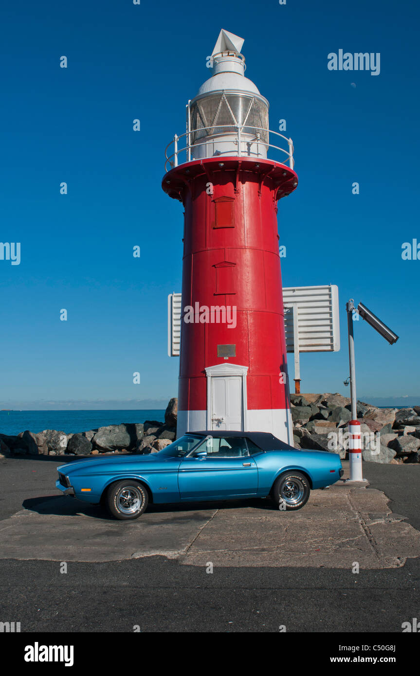 1978 Ford Mustang parked next to lighthouse at the entrance to Fremantle Western Australia Stock Photo