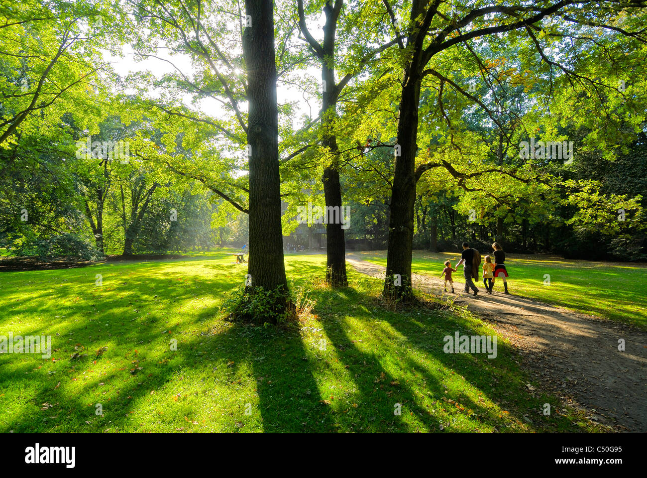 Berlin. Germany. Family walking in the Tiergrten park. Stock Photo