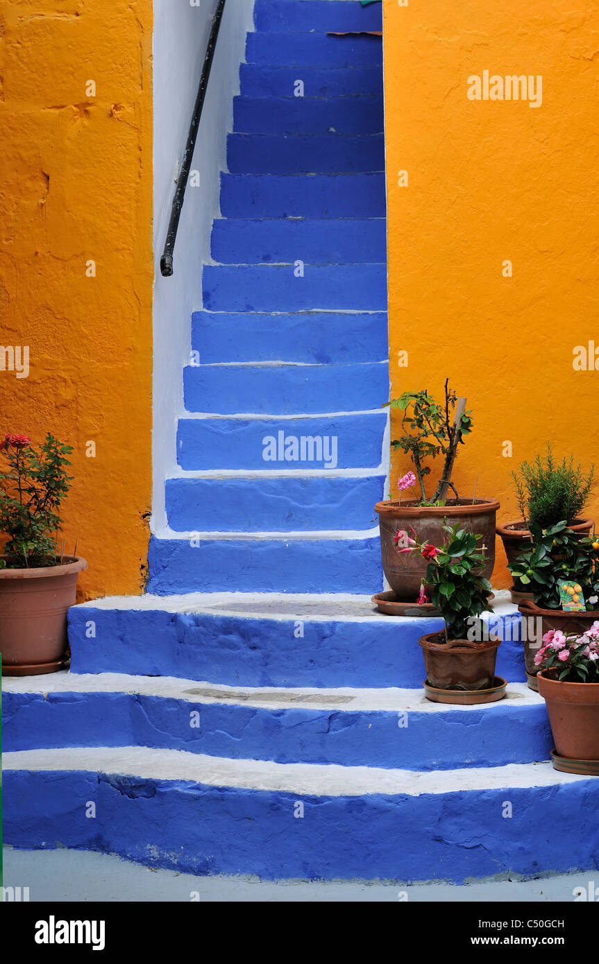 Symi. Dodecanese Islands. Greece. Brightly coloured steps in Gialos. Stock Photo