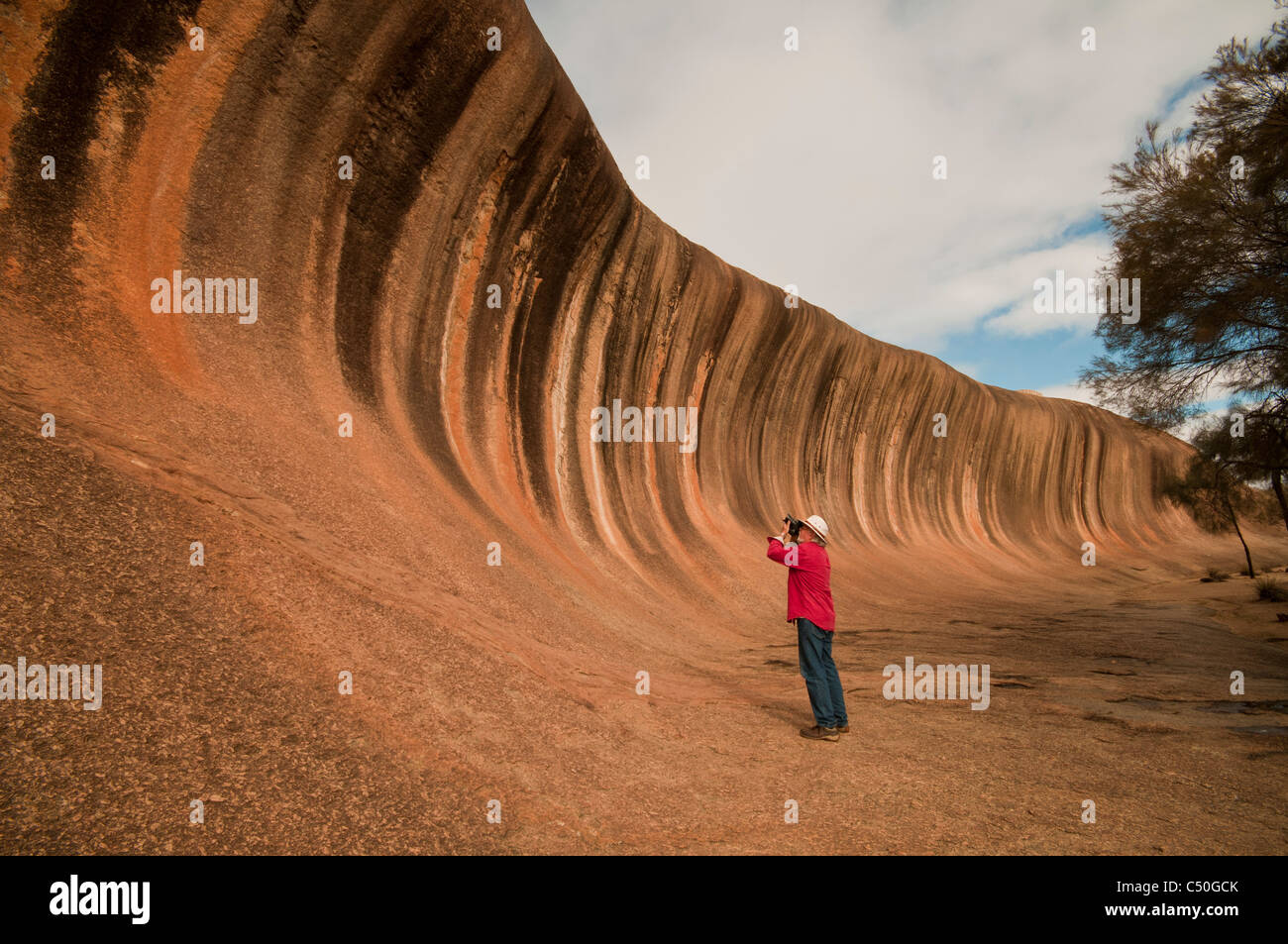 Photographing Wave Rock a natural geological formation near Hyden in Westen Australia Stock Photo