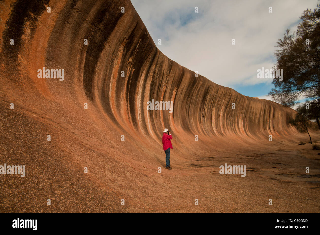 Photographing Wave Rock a natural geological formation near Hyden in Westen Australia Stock Photo