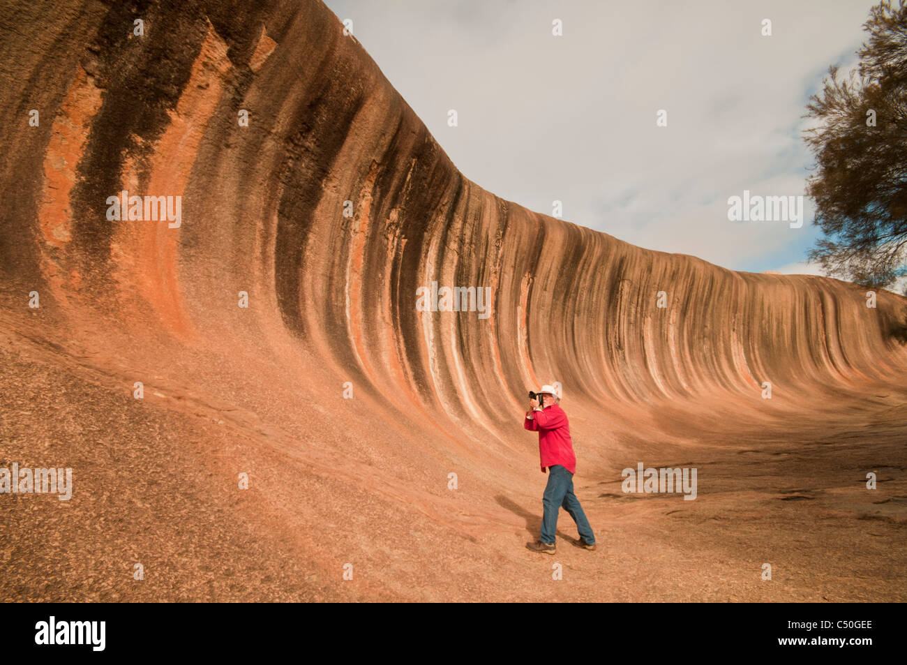 Photographing Wave Rock a natural geological formation near Hyden in Westen Australia Stock Photo