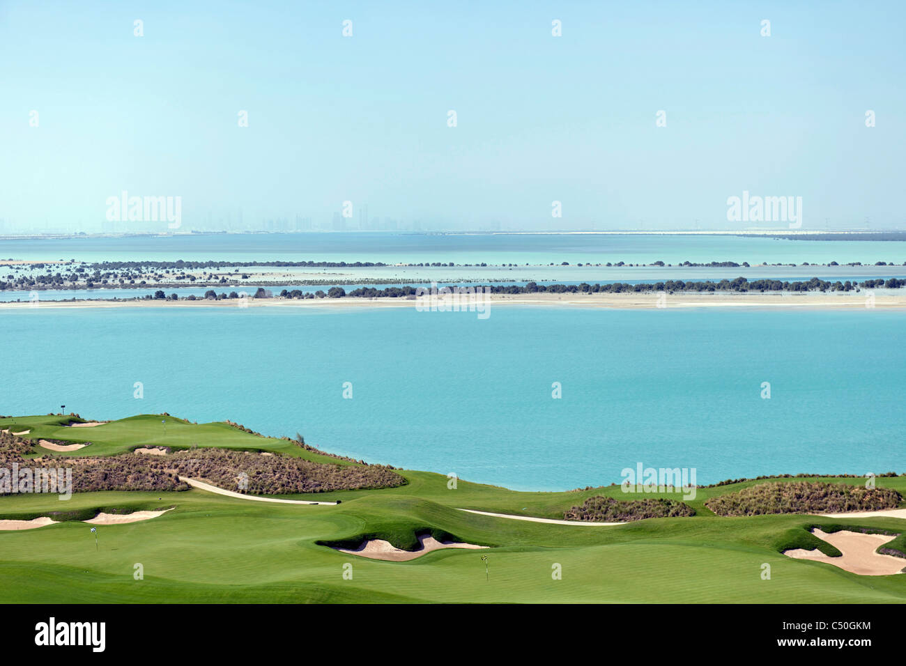 Yas Links Golf Course on Yas Island, skyline of Abu Dhabi at the back