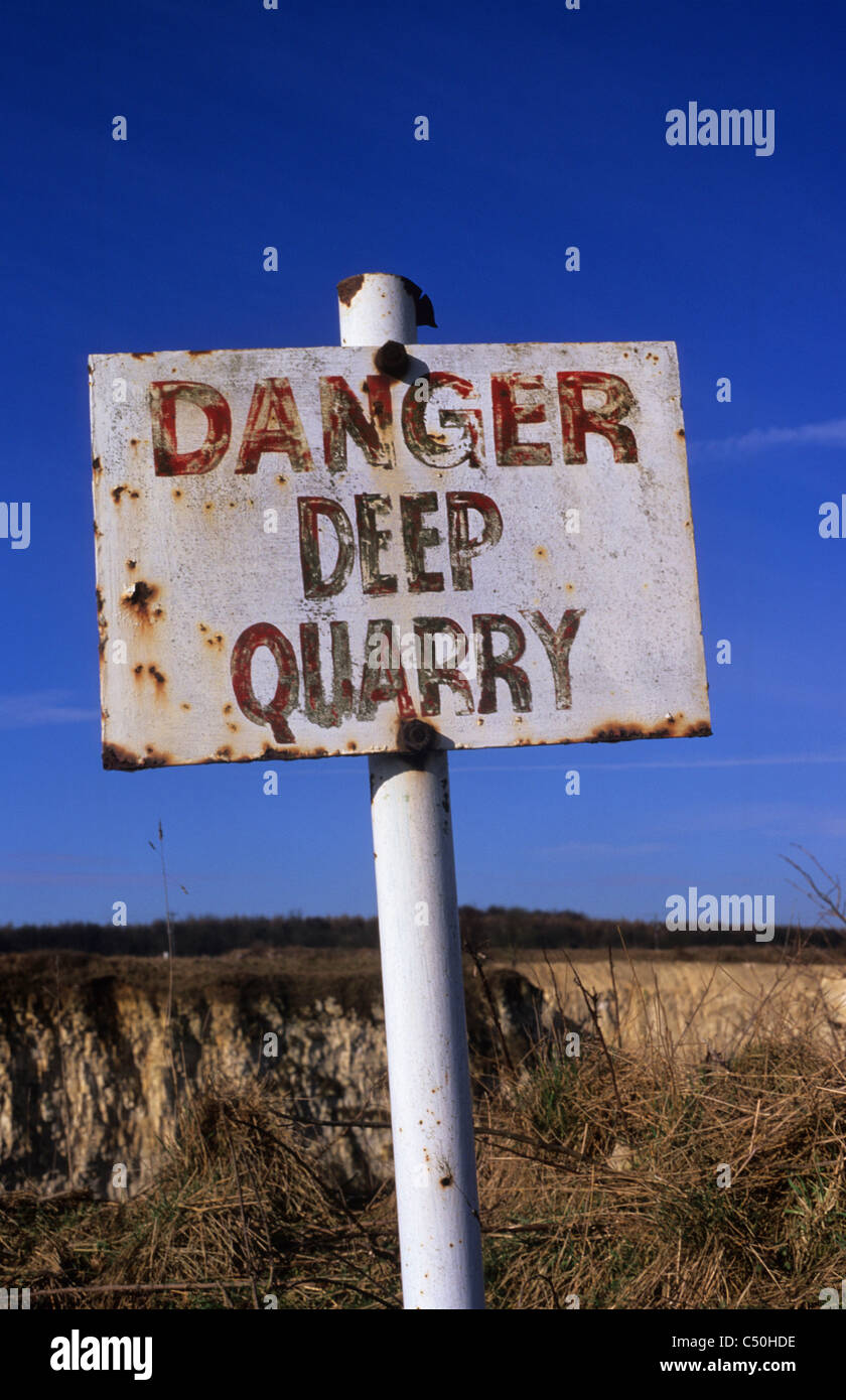 danger deep quarry warning sign at limestone quarry Yorkshire UK Stock