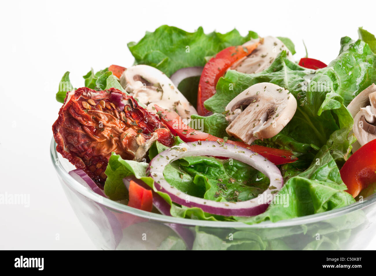 Salad with dried tomatoes, champignon and onion. Stock Photo
