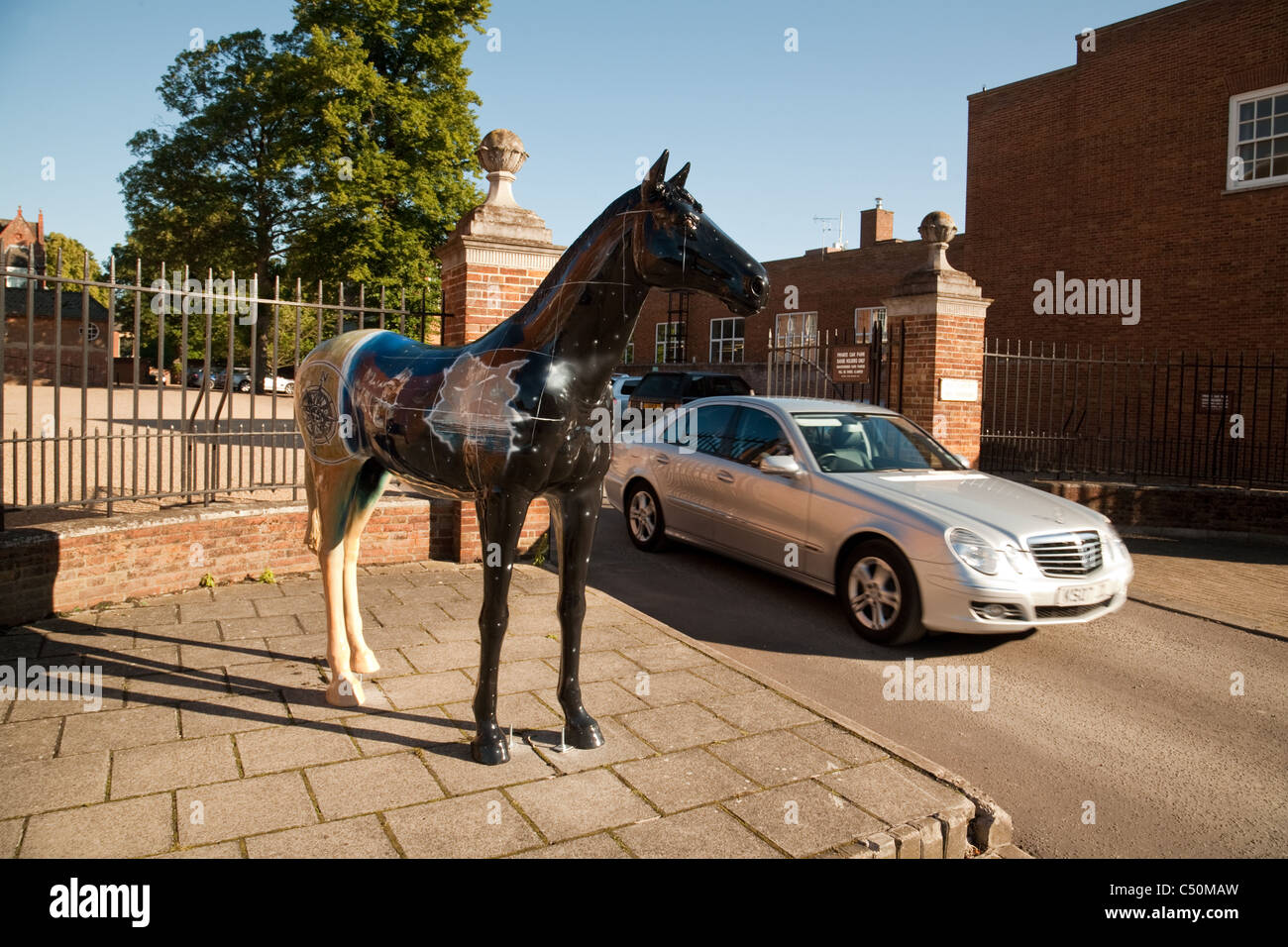 Painted horse outside the entrance to the Jockey club, Newmarket town, Suffolk UK Stock Photo