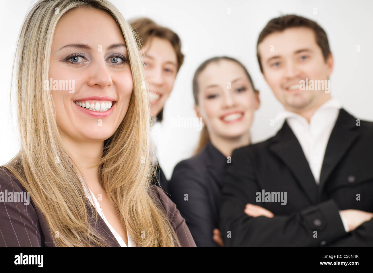 team of successful smiling young business people Stock Photo - Alamy