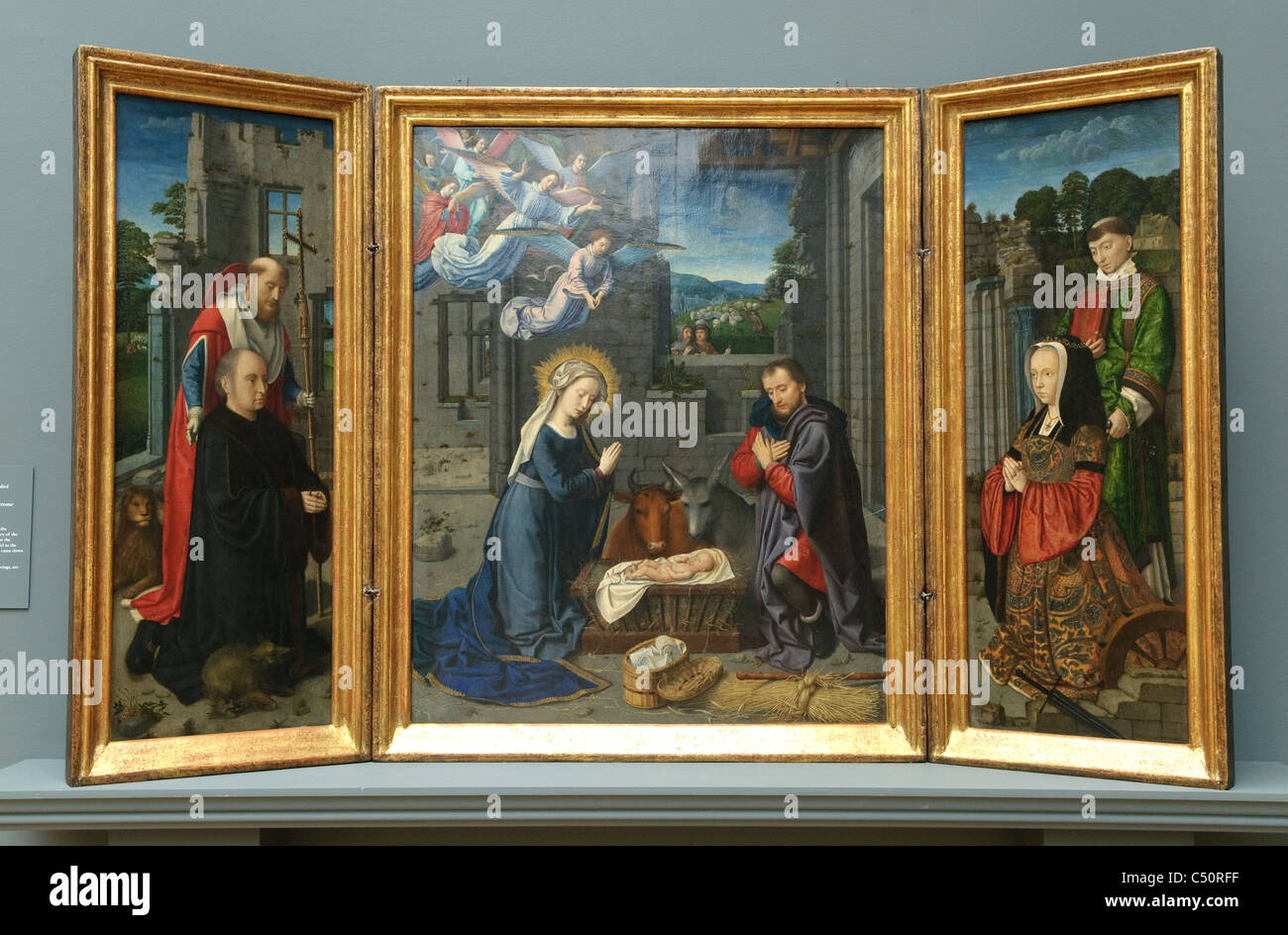 The Nativity with Donors and Saints Jerome and Leonard, ca. 1510–15, by Gerard David, Stock Photo