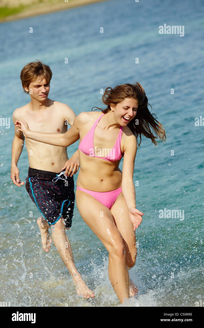 Lady beautiful boob Guy running around bikini