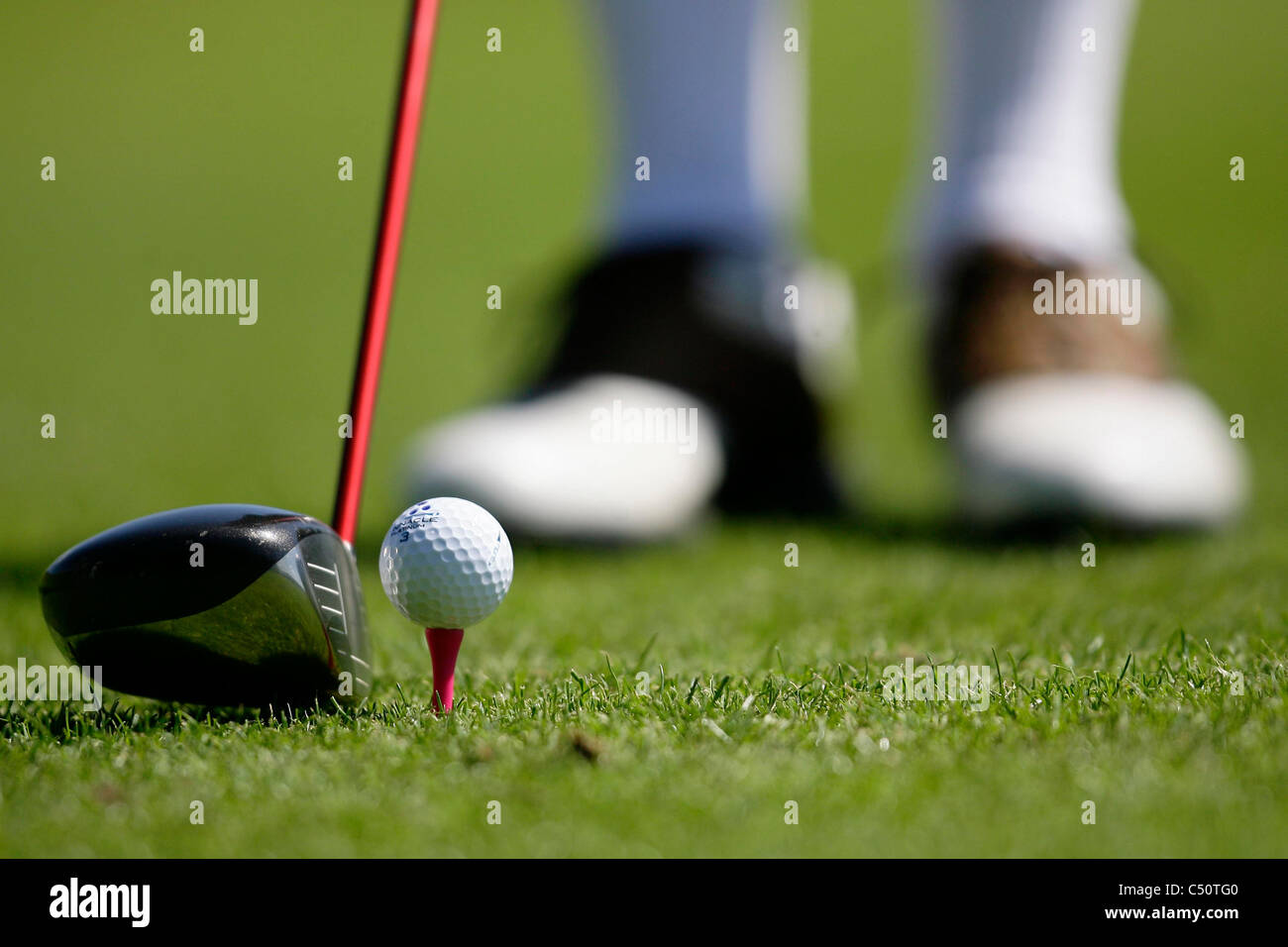 Golfer prepares to tee off. Picture by James Boardman. Stock Photo