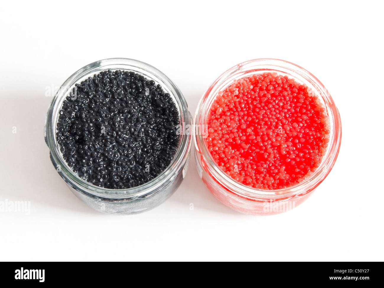 red and black caviar in glass jars on withe background Stock Photo