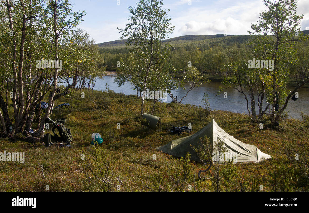 Camp near to river Stock Photo - Alamy