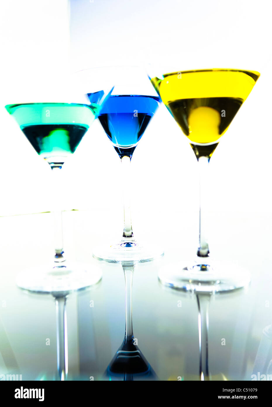 Apple,blueberry and lemon martini's on reflective background. Stock Photo