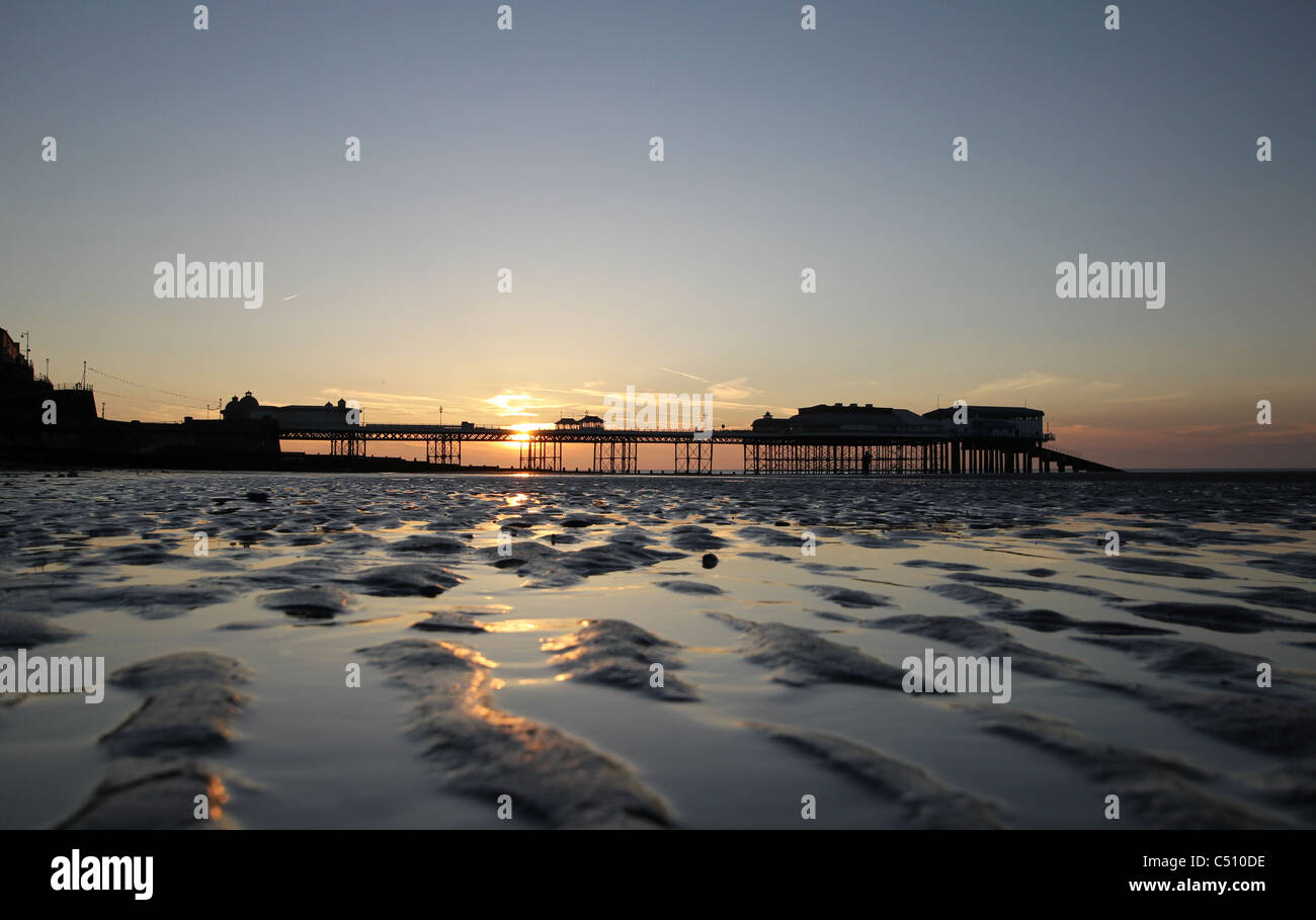 Cromer Pier just before the sun sets during an evening in June Stock Photo