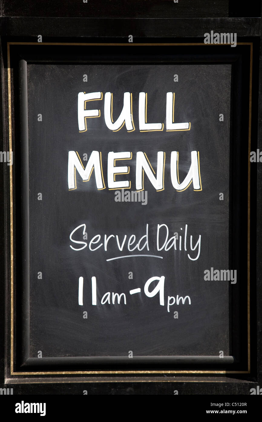 Menu sign serving food between 11am to 9pm Stock Photo - Alamy