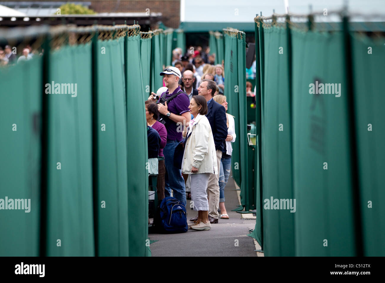 Spectators watching the The Wimbledon Tennis Championships 2011 Outside Courts. Photo:Jeff Gilbert Stock Photo