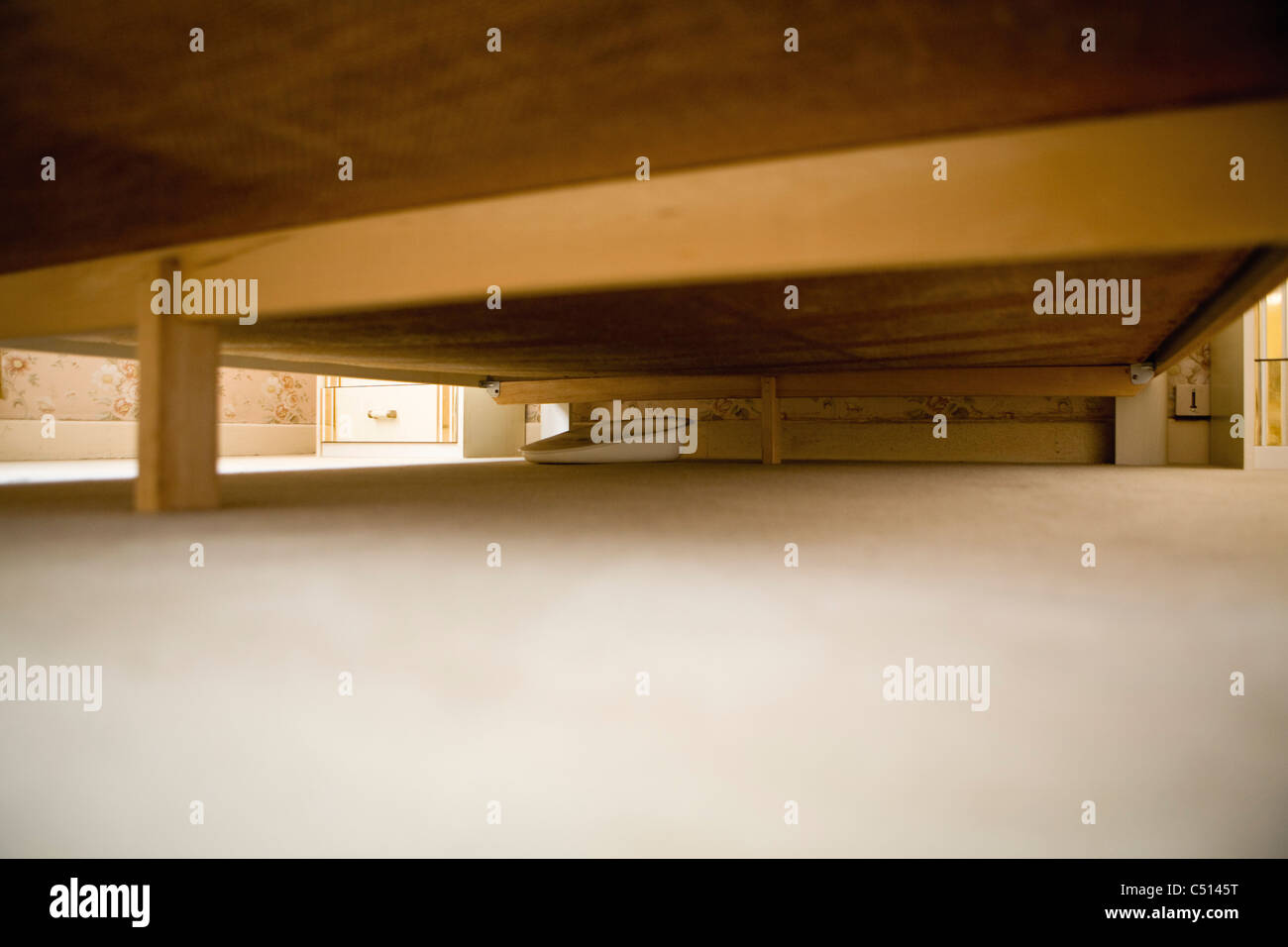 Bed pan underneath bed Stock Photo Alamy