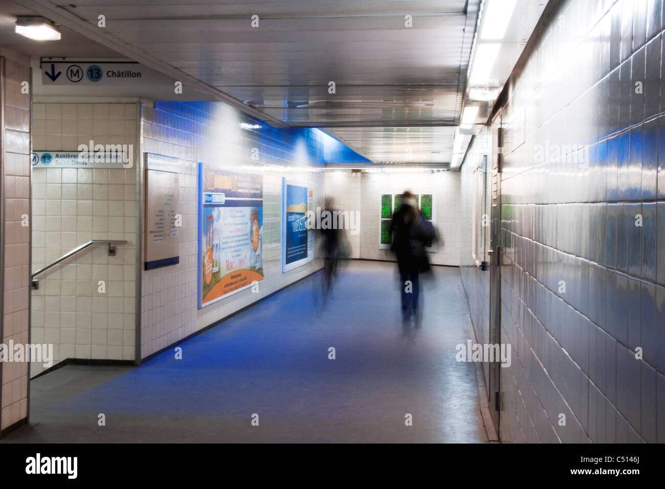 People walking in underground subway station walkway Stock Photo