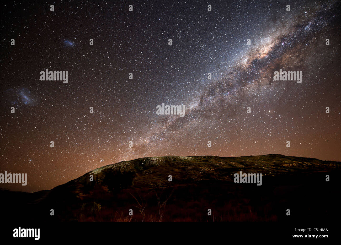 The Milky Way and its satellite galaxies the Magellanic Clouds rising ...
