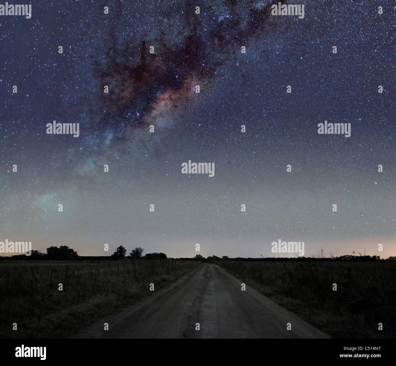 The center of the Milky Way galaxy over a rural road in Mercedes, Argentina. Stock Photo