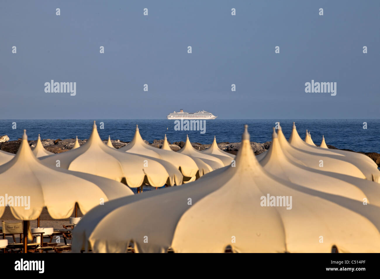 Umbrellas of the beaches on the beach of Arma di Taggia in Liguria on the Mediterranean Stock Photo