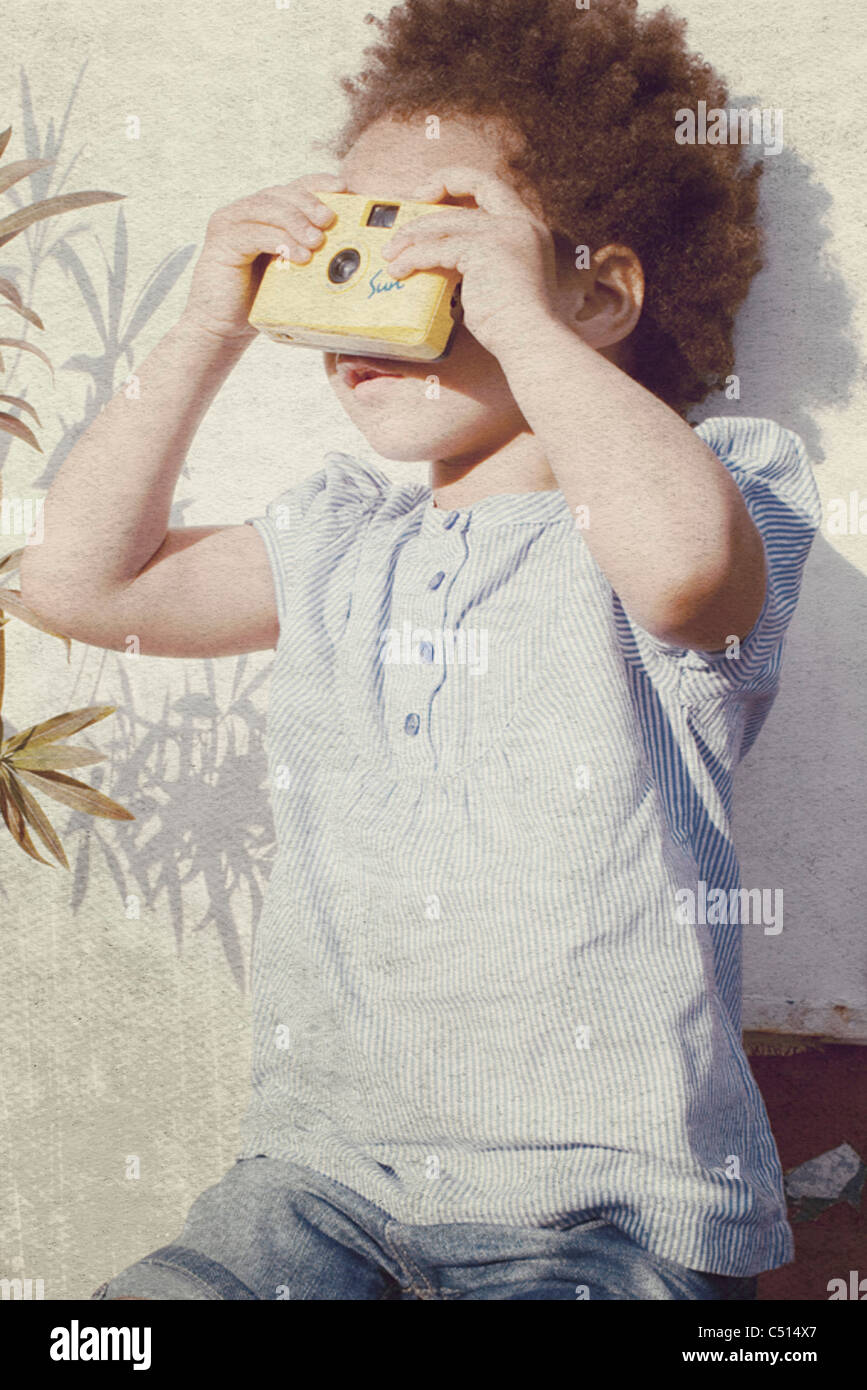 Little girl holding camera Stock Photo