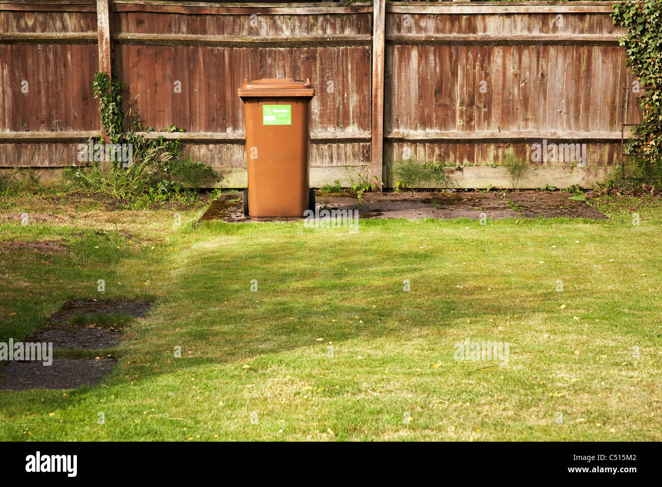 Brown garden wheelie bin Stock Photo Alamy
