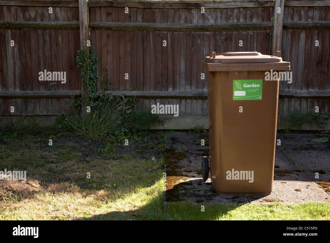 Brown garden wheelie bin Stock Photo Alamy