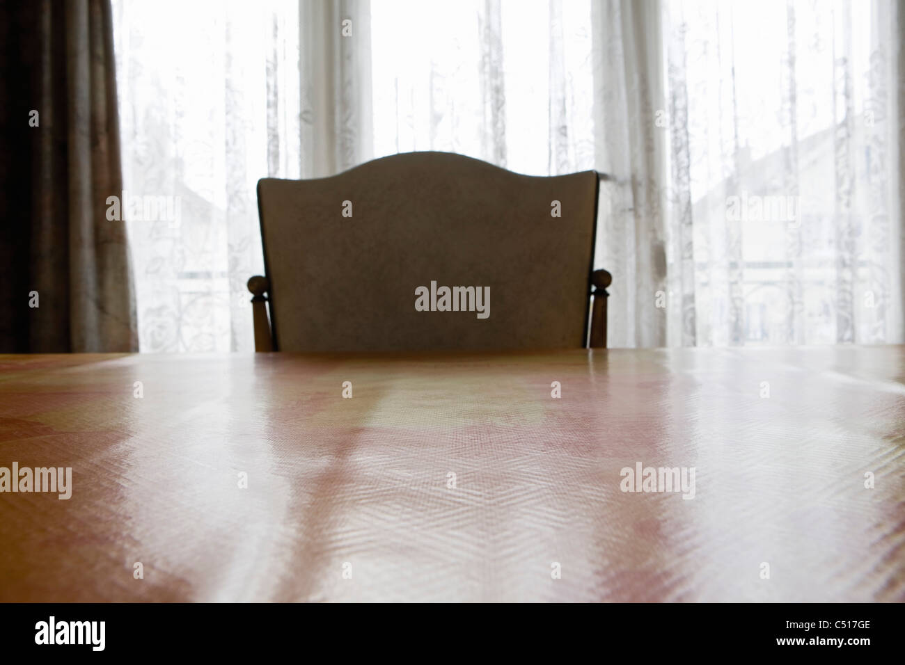 Empty chair at table Stock Photo Alamy