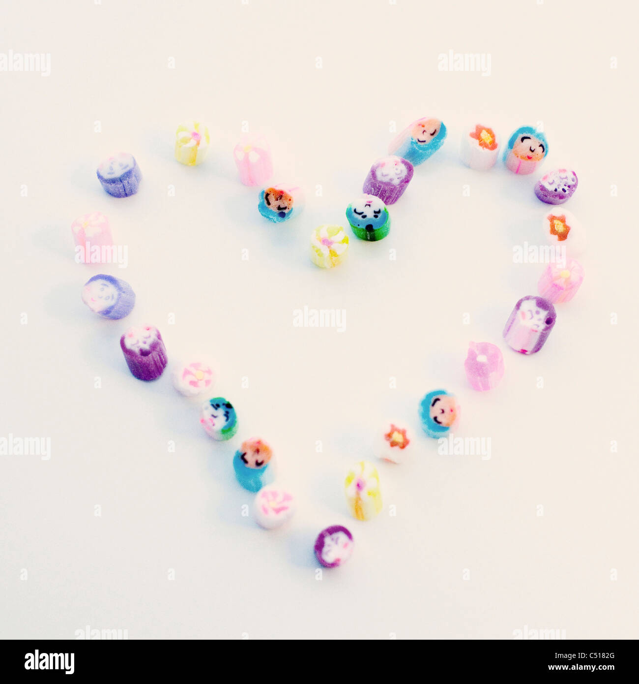 Rock candies arranged in heart shape Stock Photo