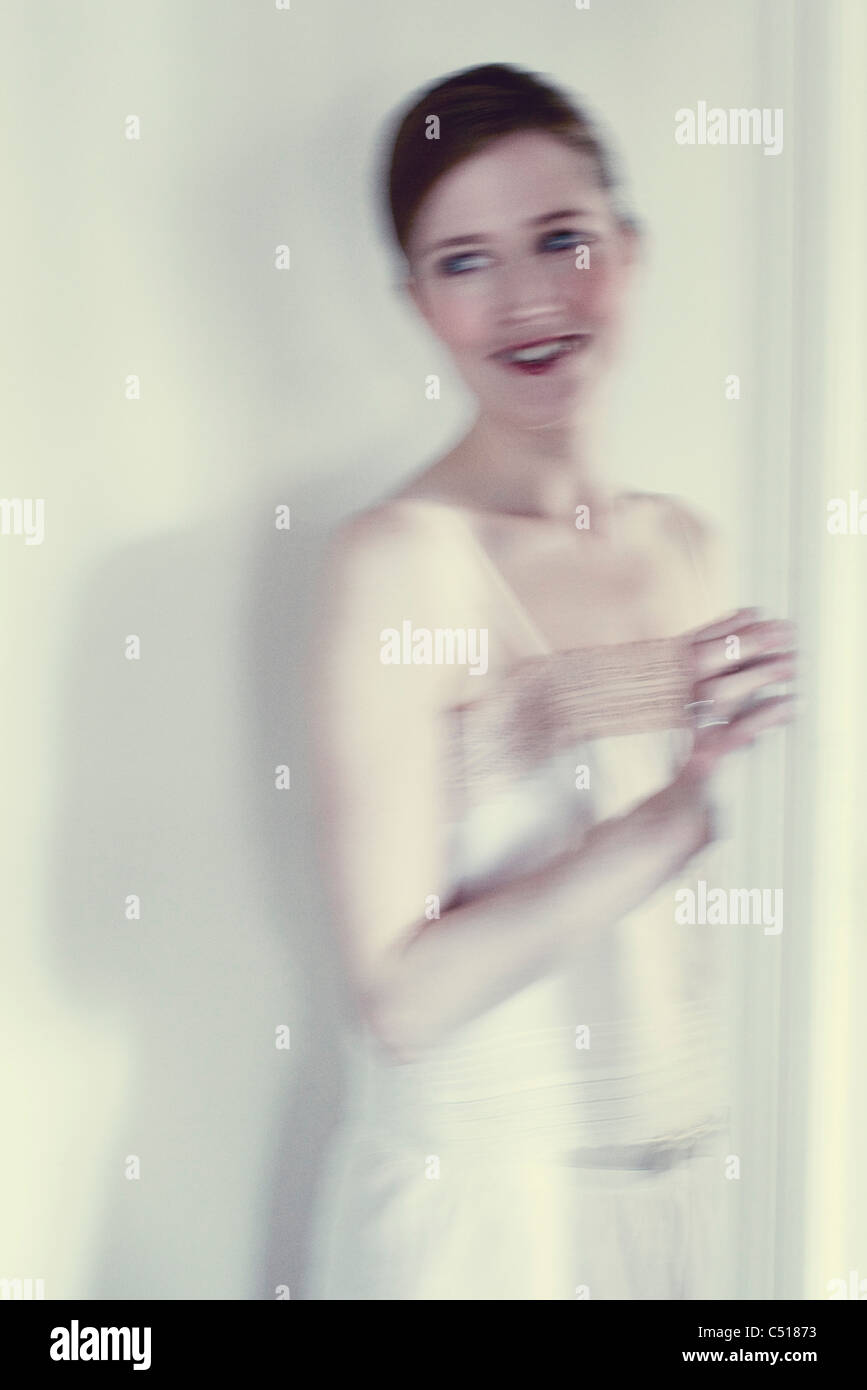 Smiling mid-adult woman, blurred motion Stock Photo